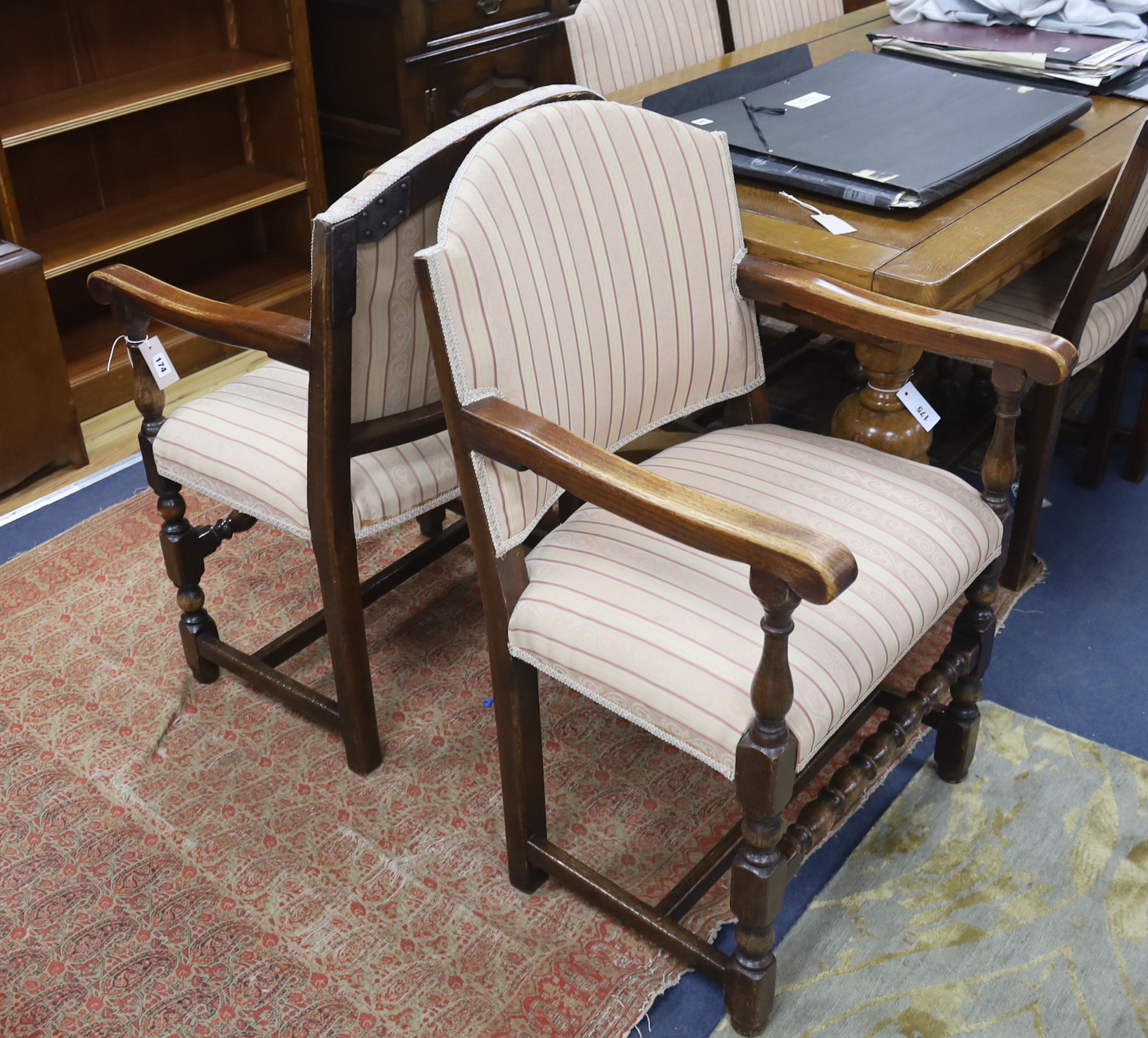 A set of eight 18th century style upholstered oak dining chairs, two with arms